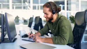 Truck dispatcher reviewing load boards and routes to support carrier operations