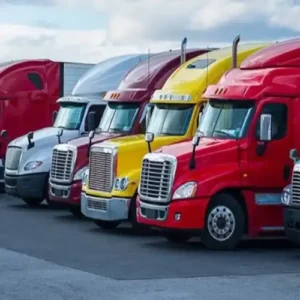Dry van and flatbed trucks parked
