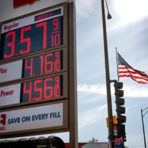 Diesel pump close-up with gas price sign (illustrating Iran war and diesel prices) (1)