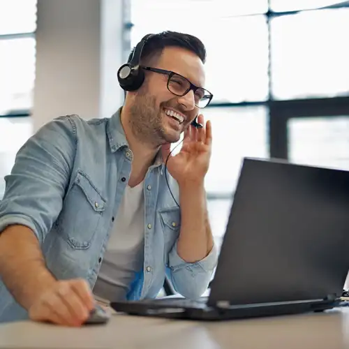 hotshot dispatcher handling paperwork and updates while the driver waits at a receiver